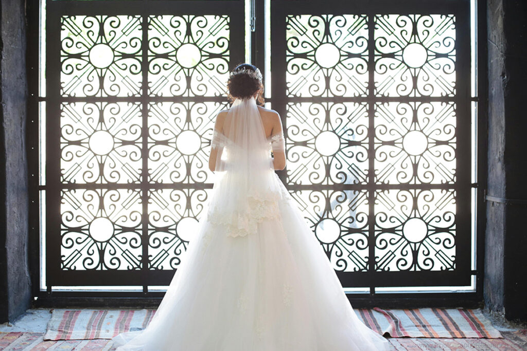 Wedding photography bride at window