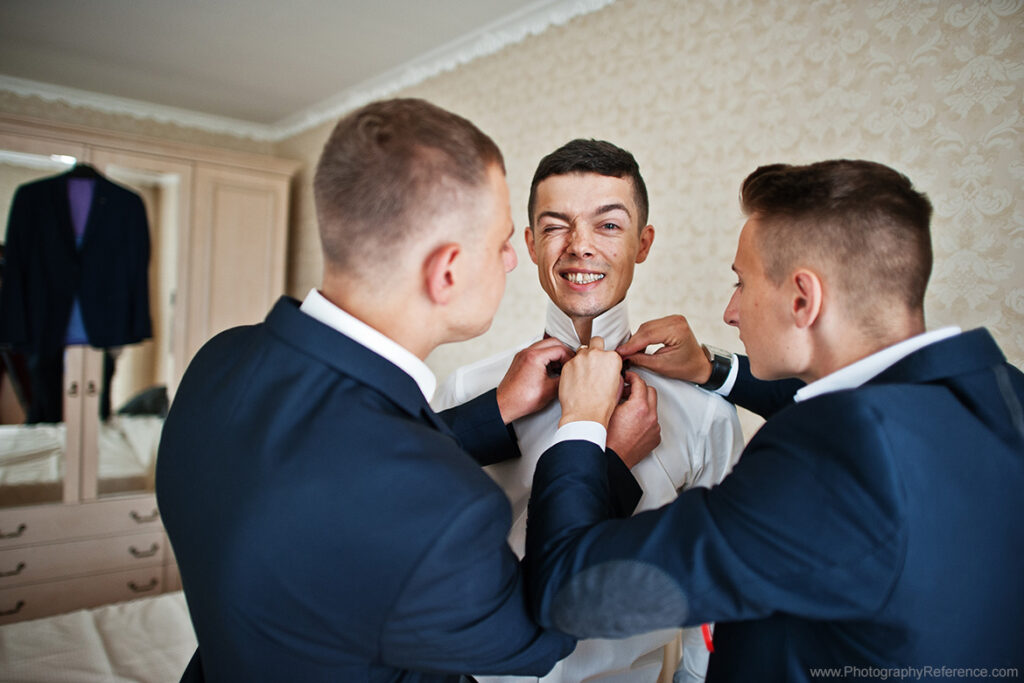 Wedding photography groom getting ready